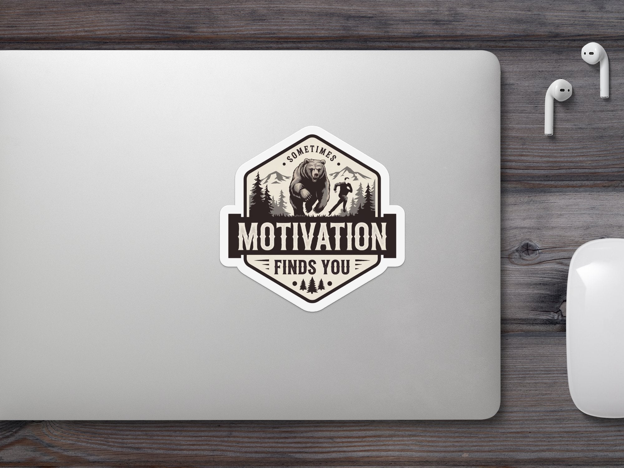 Hexagonal sticker with bear and runner illustration, reading "Sometimes Motivation Finds You".