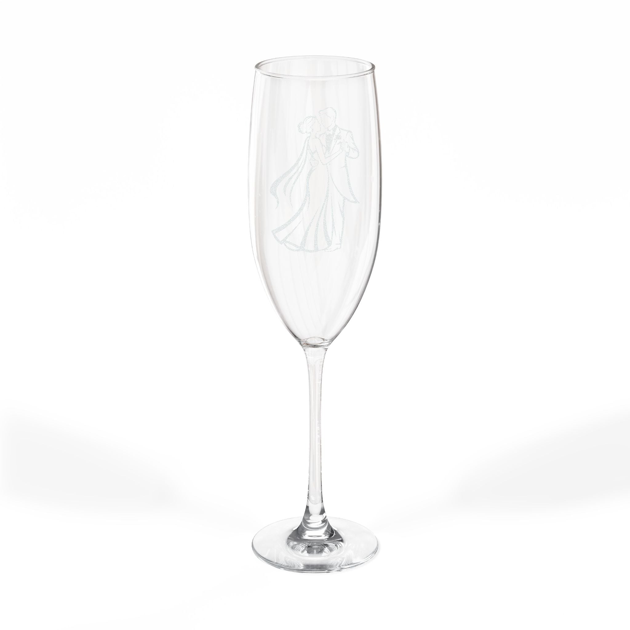 Champagne flute with etched wedding couple illustration on white background.