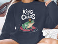 Frog wearing crown on lily pad, "King of Chaos" text above.