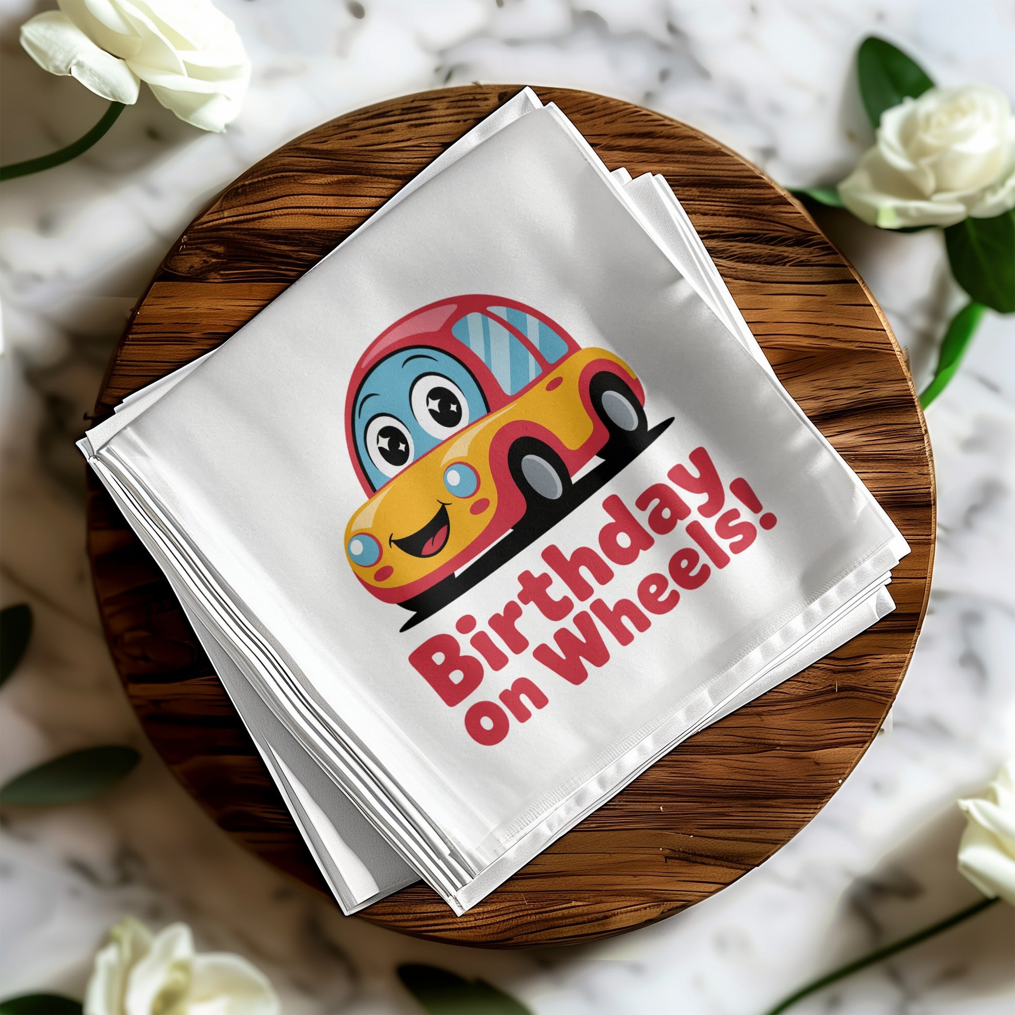 Cartoon car with "Birthday on Wheels!" text on a white napkin.