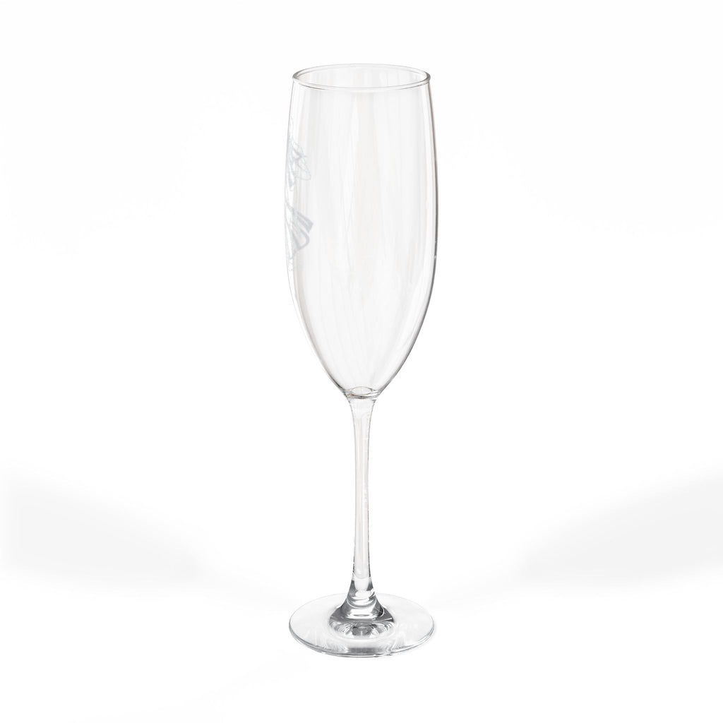 Clear champagne flute with etched floral design, on a white background.