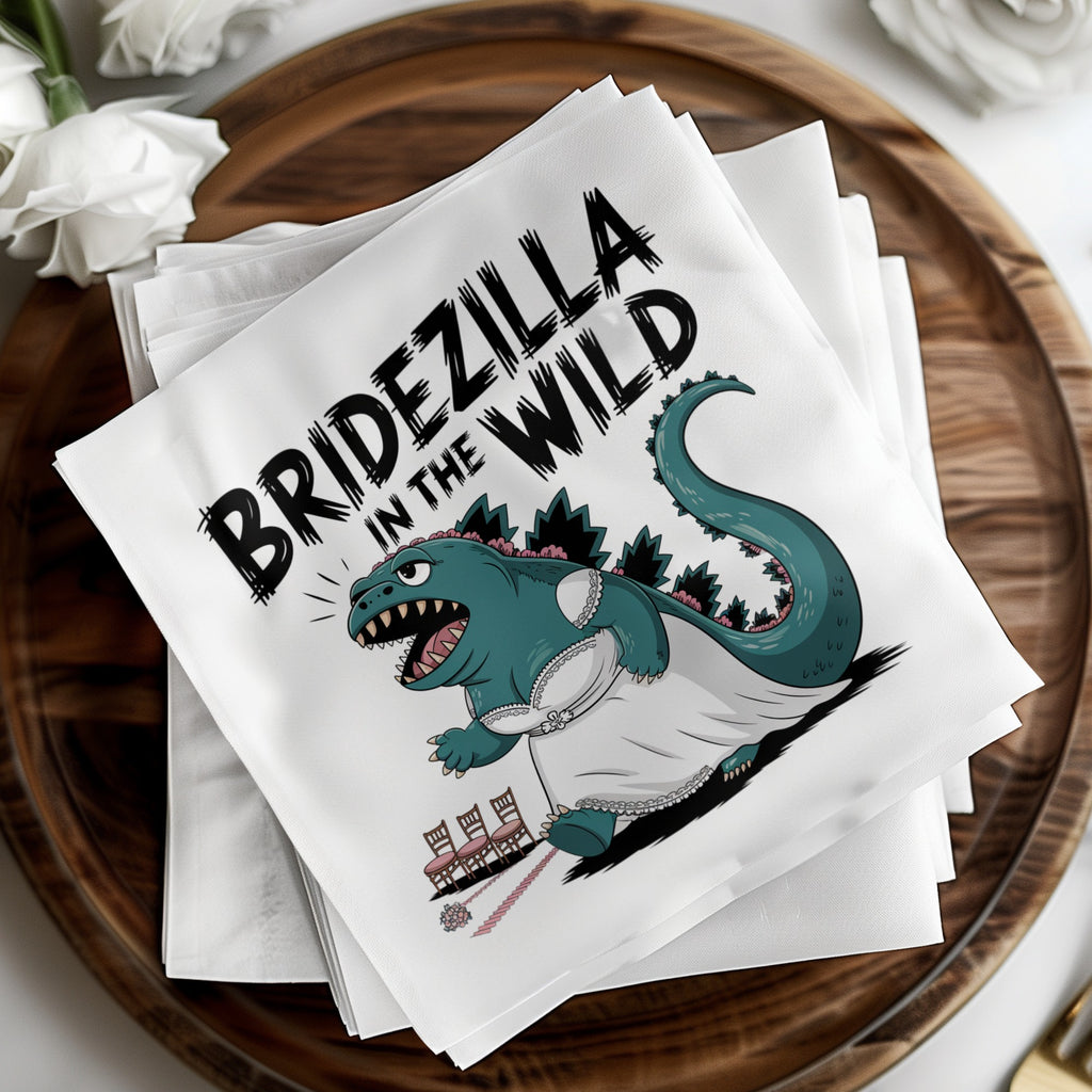 Bridezilla in the Wild text on a cocktail napkin featuring a Godzilla character in a wedding dress.