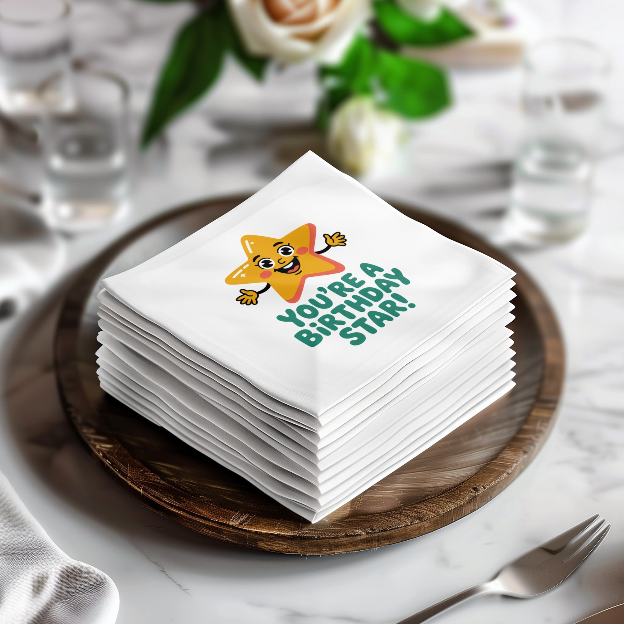 Stack of white napkins with a "You're a Birthday Star!" cartoon design.