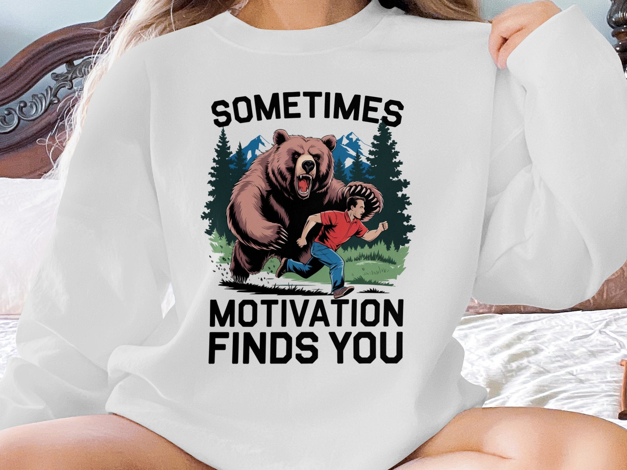 Bear chasing man with text "Sometimes Motivation Finds You".