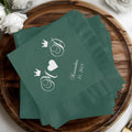 Green napkins with monogrammed crowns and "November 24, 2025".