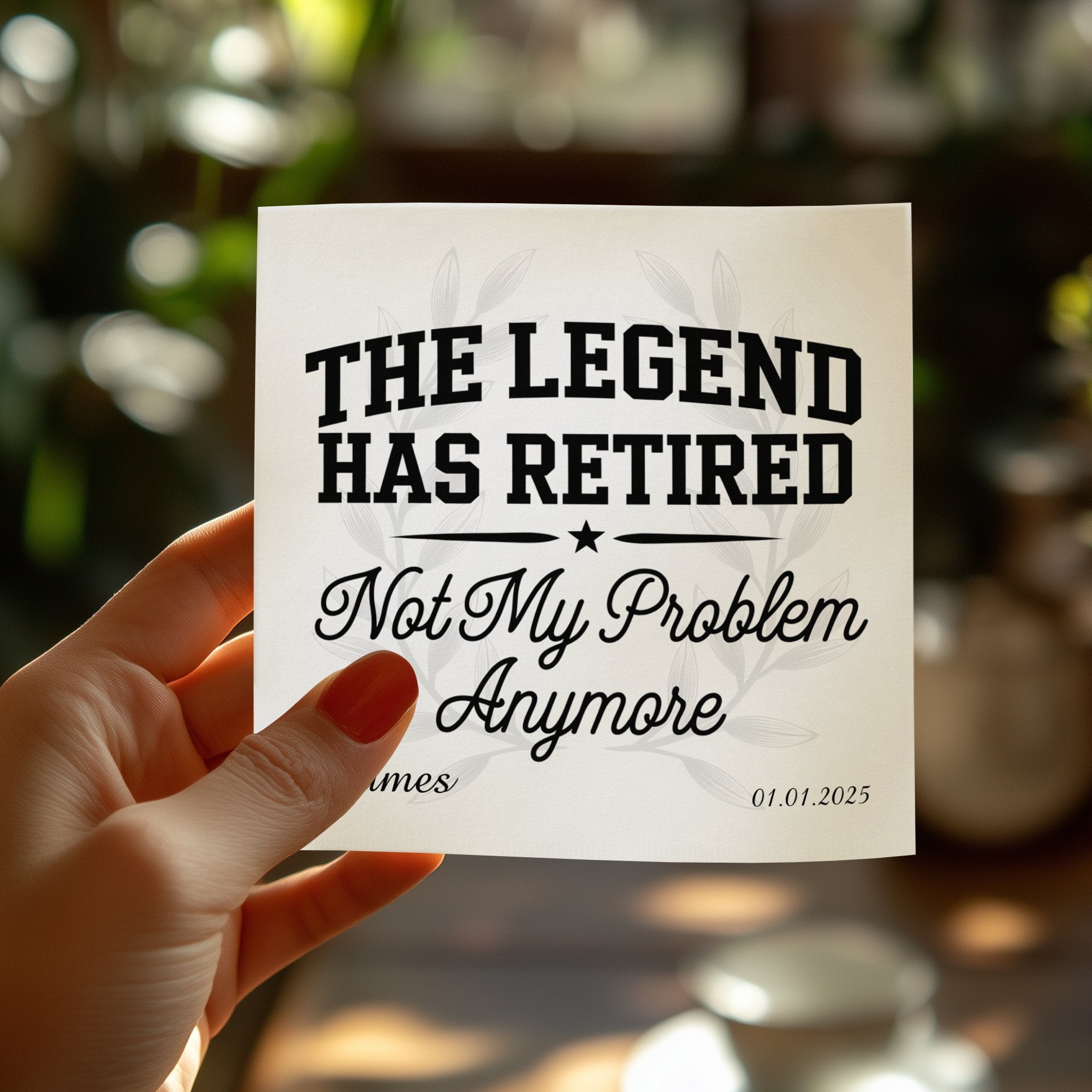 "The Legend Has Retired, Not My Problem Anymore" text on white tile held by hand.
