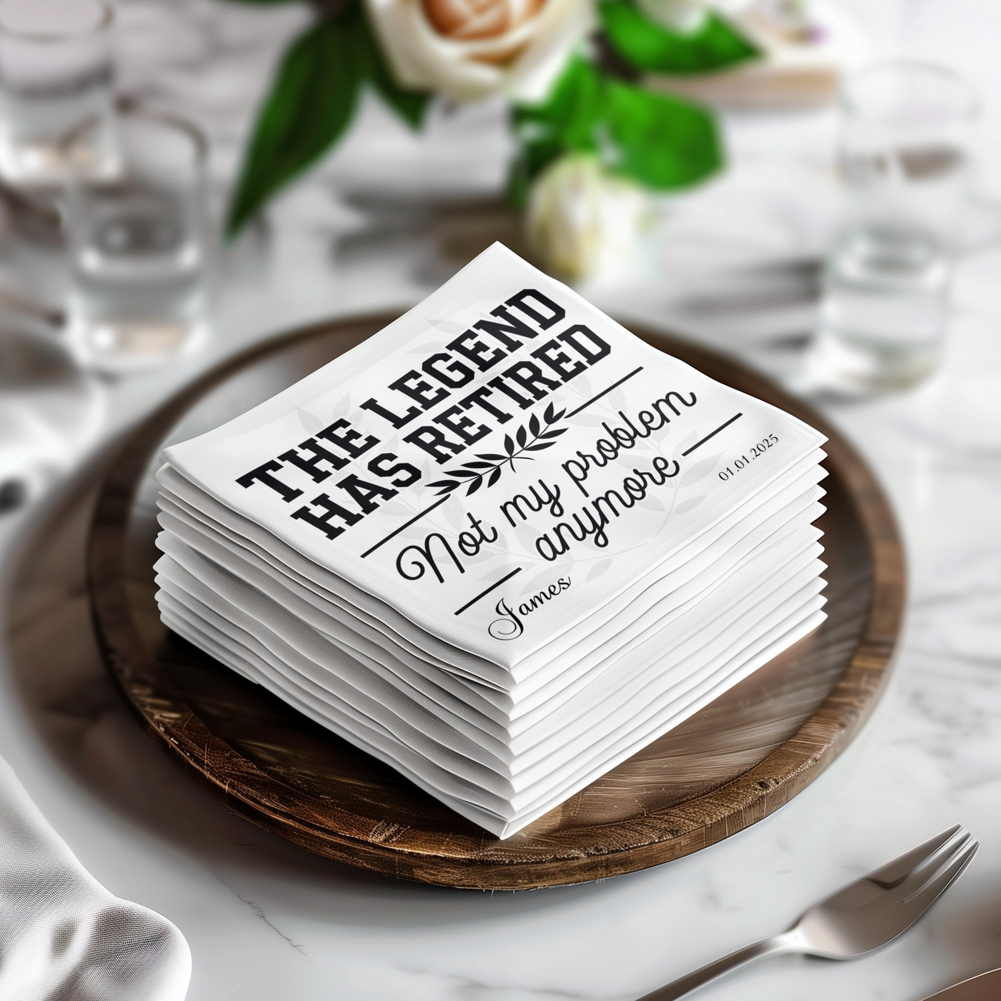 Stack of napkins with "THE LEGEND HAS RETIRED" and "James" printed in black.