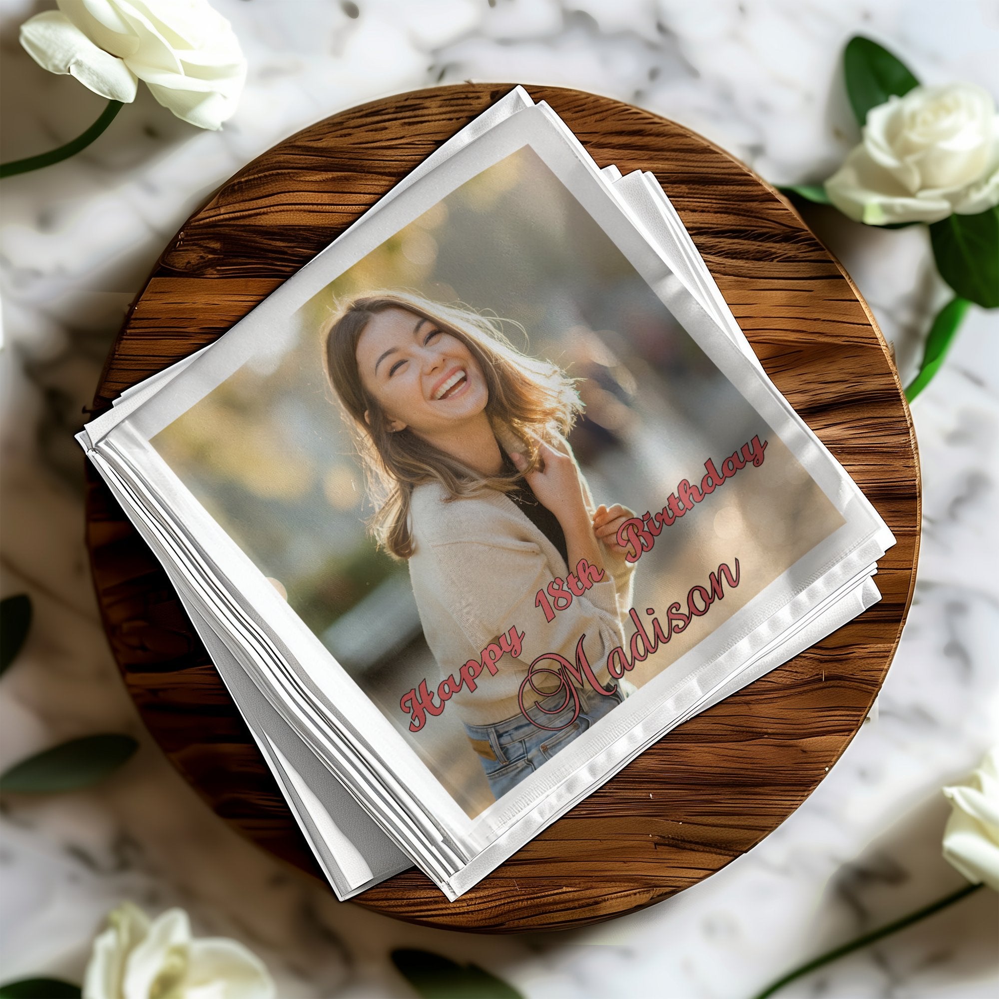 Stack of napkins with a birthday photo and text.