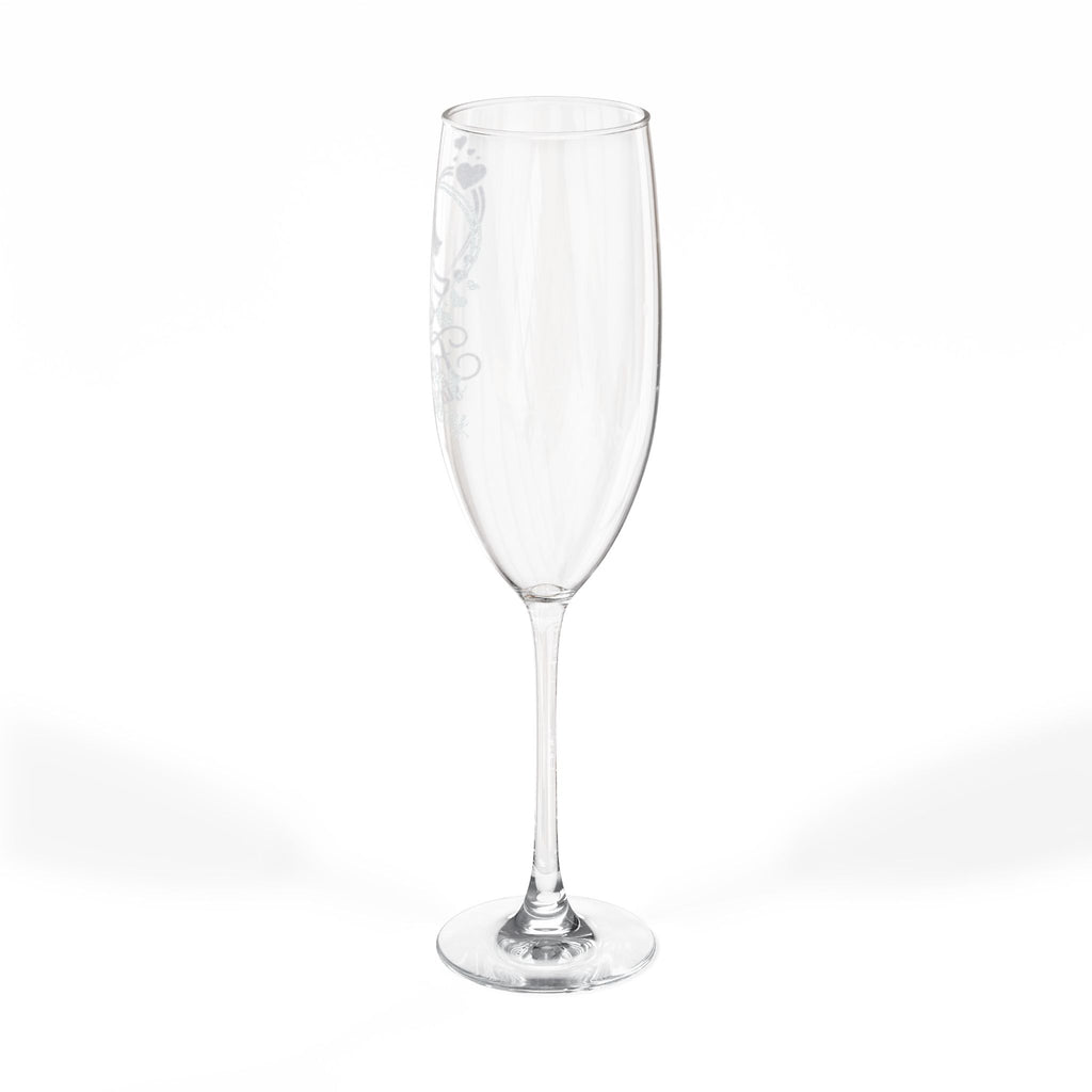 Clear champagne flute with etched heart and scroll design.