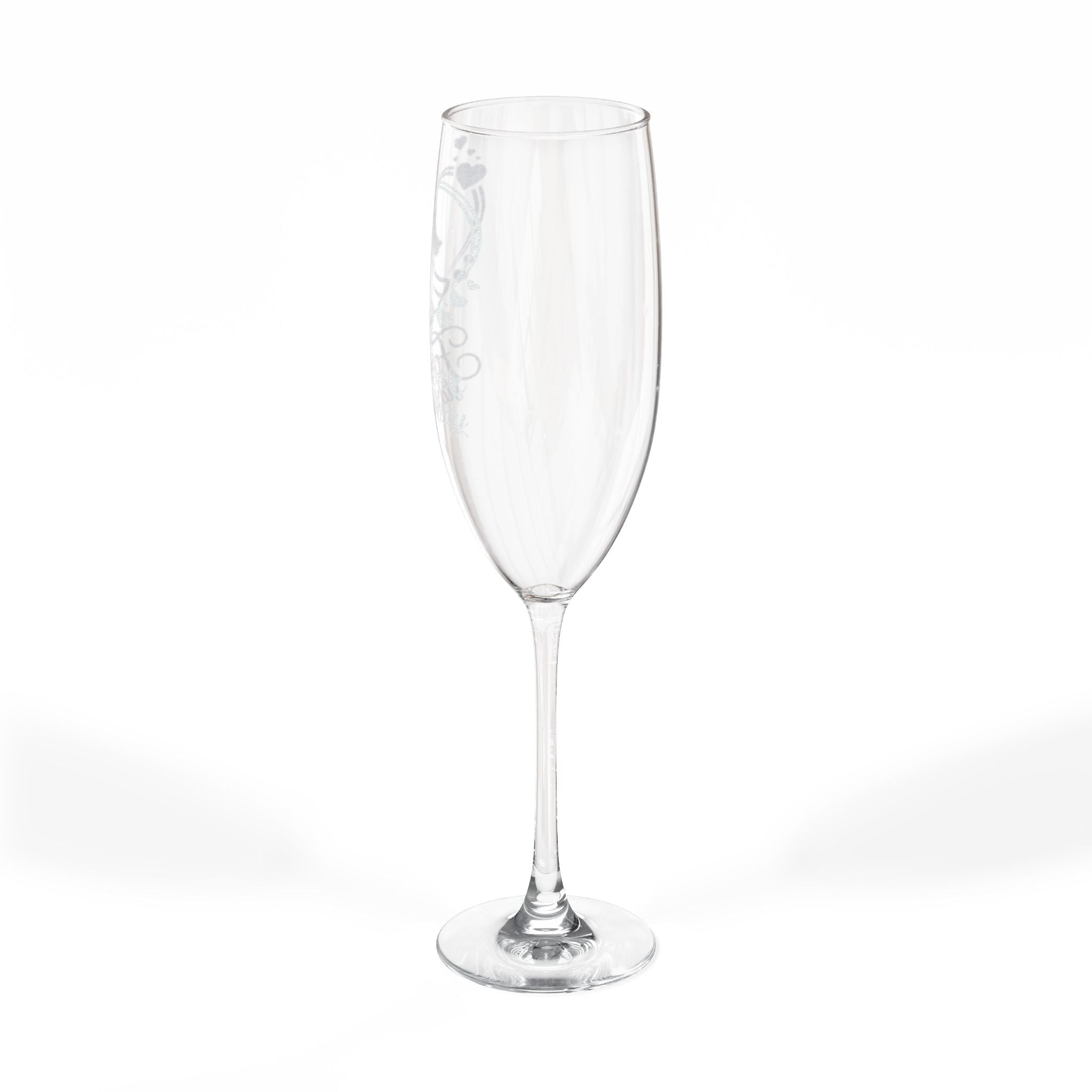 Clear champagne flute with etched heart and scroll design.