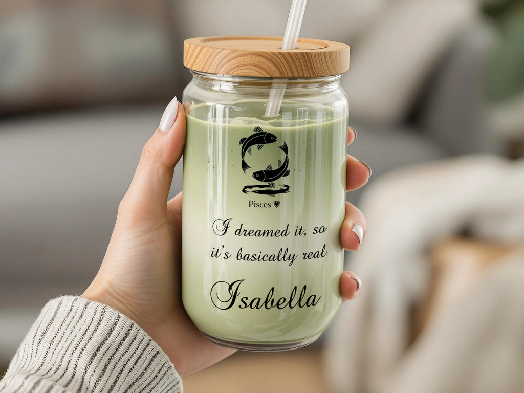Pisces zodiac symbol on glass tumbler with bamboo lid and straw, text reads "I dreamed it, so it's basically real Isabella".