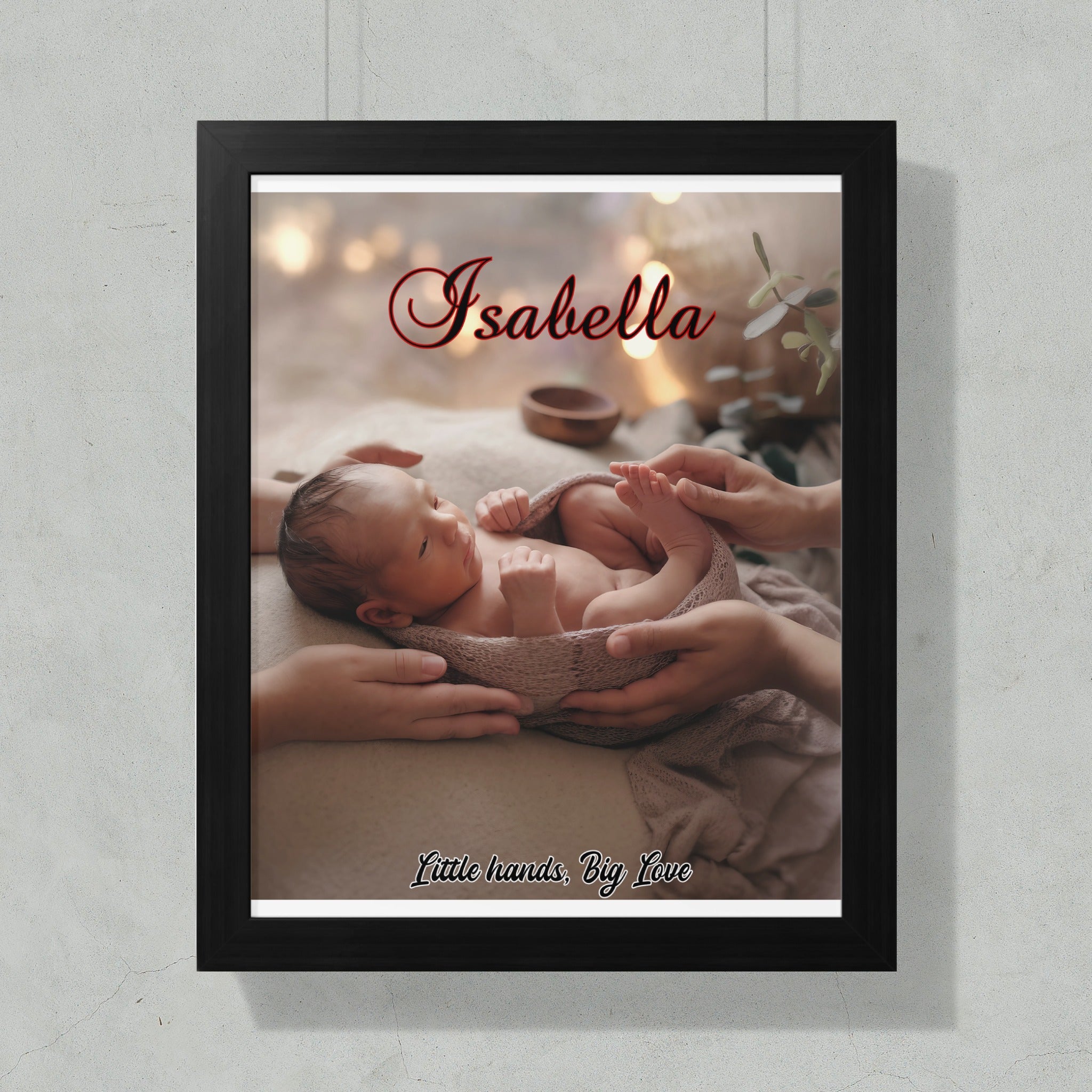 Newborn baby Isabella wrapped in a blanket, held by hands.