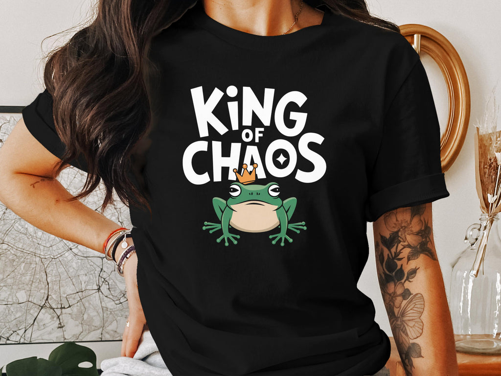 T-shirt with "KING OF CHAOS" text and a cartoon frog wearing a crown.