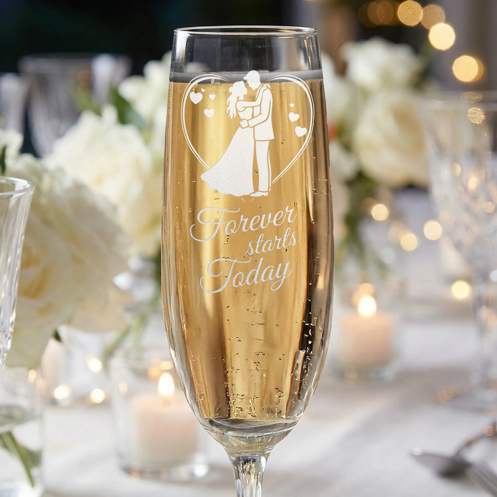 Champagne flute with etched bride and groom silhouette and "Forever starts today" text.