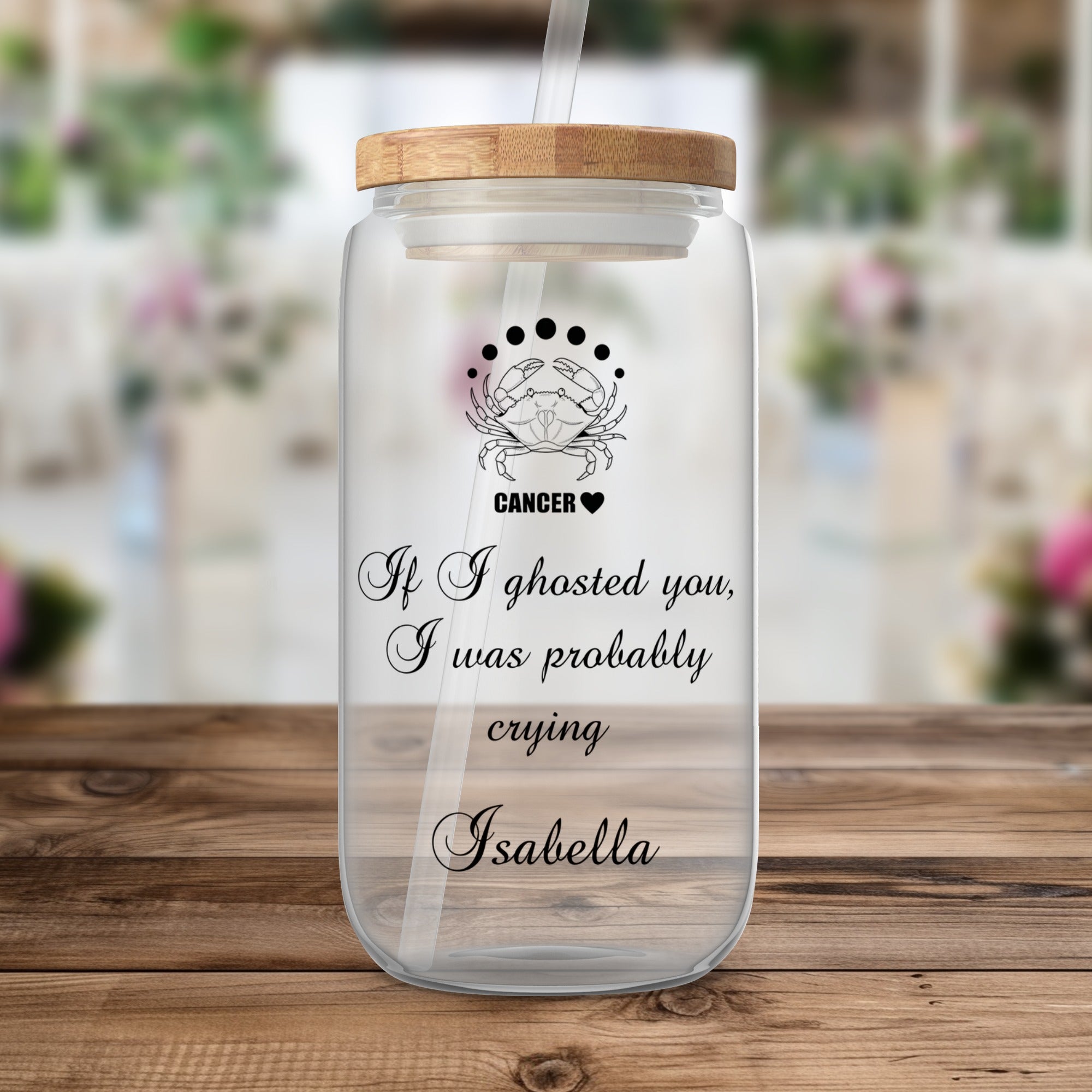 Glass tumbler with straw, featuring Cancer zodiac symbol and text.
