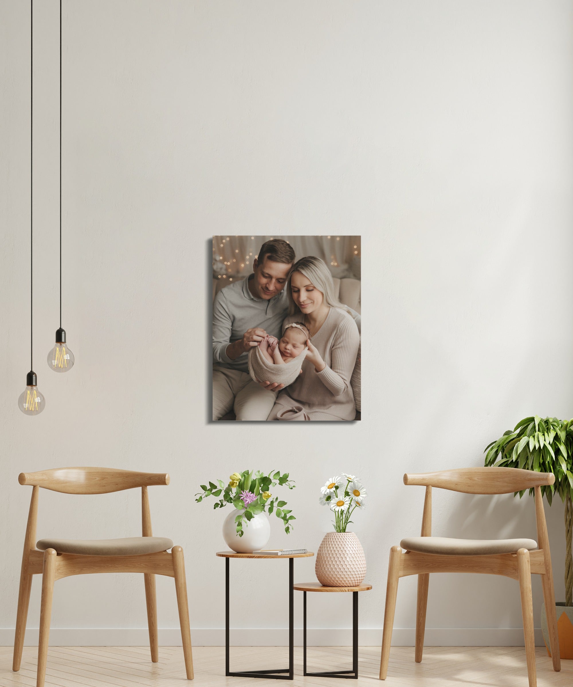 Family with newborn baby on canvas print above two chairs.