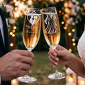 Two champagne flutes with "Mr & Mrs Rodriguez" and etched figures toast.