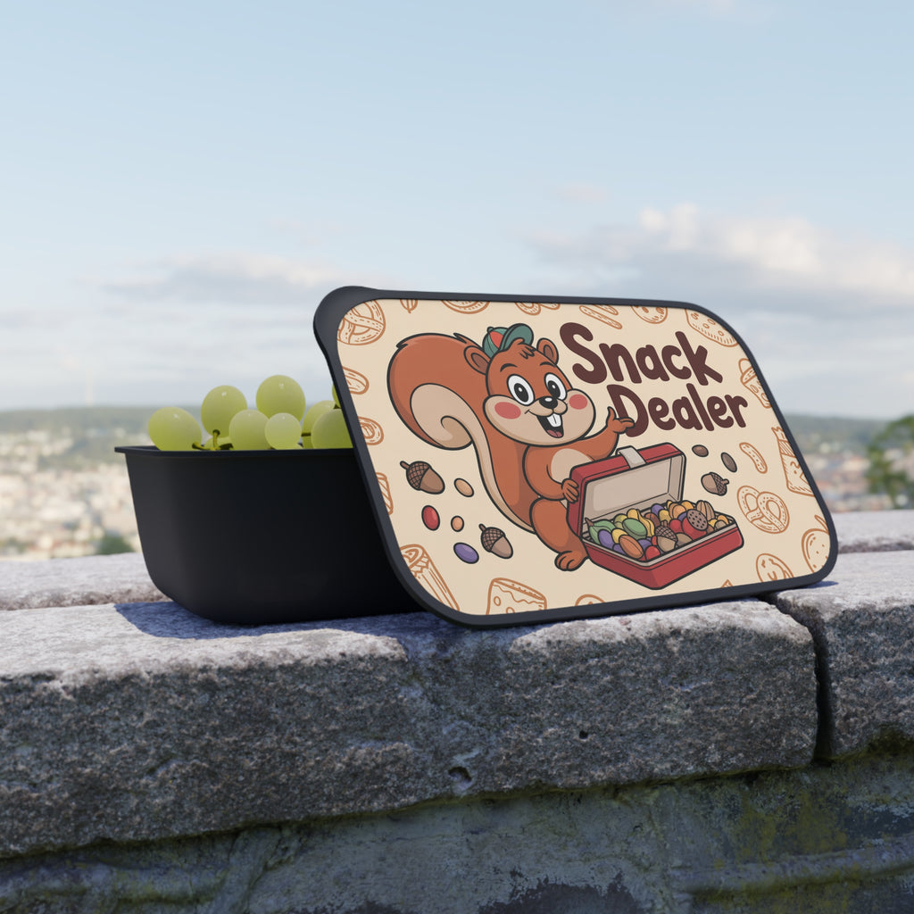 Black snack container with lid open showing grapes and "Snack Dealer" illustration.