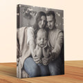 Canvas print of parents holding newborn baby with "Henry" text.