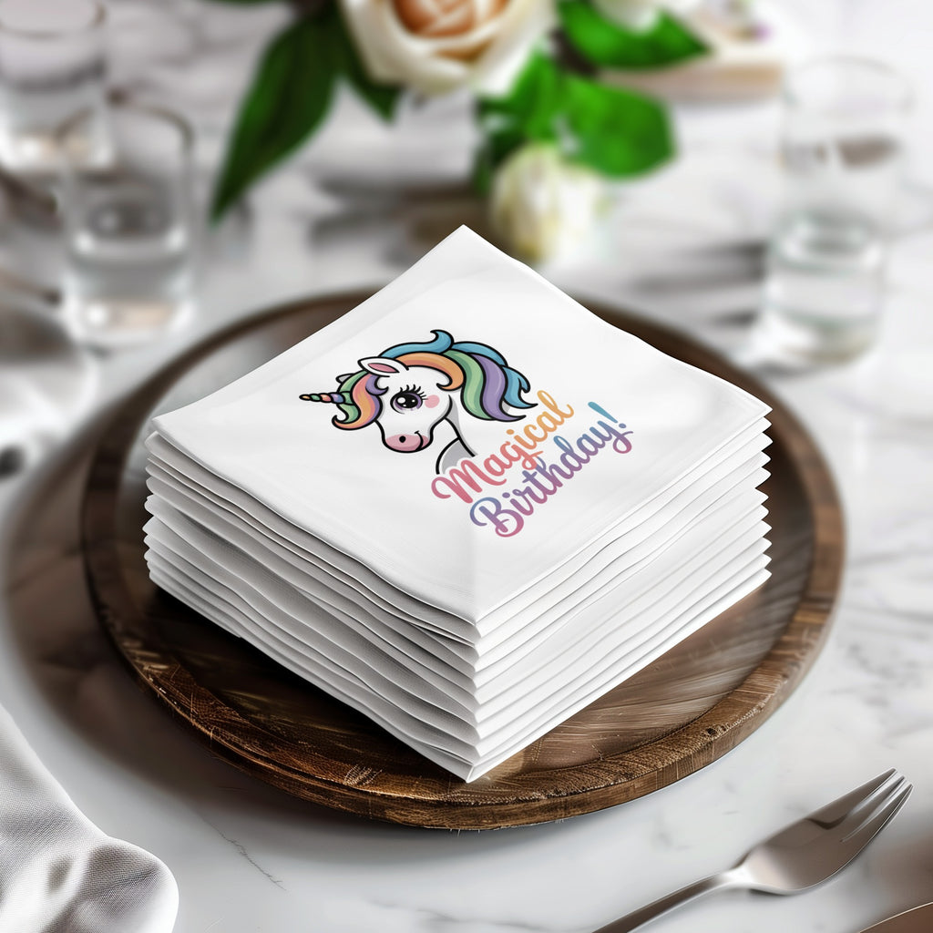 Stack of white napkins featuring a cartoon unicorn and "Magical Birthday!" text.