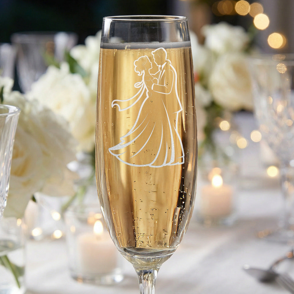 Champagne flute with etched silhouette of a couple dancing.