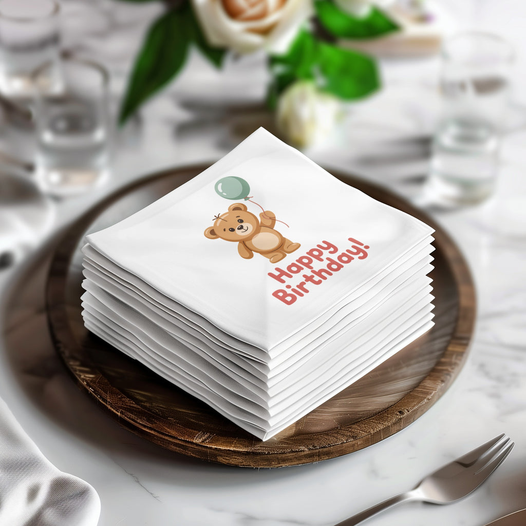 Stack of napkins with a teddy bear holding a balloon and "Happy Birthday!" text.