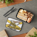Bento box with sandwich, cheese, pistachios, and mandarins, lid reads "Warning: Highly Delicious Content."