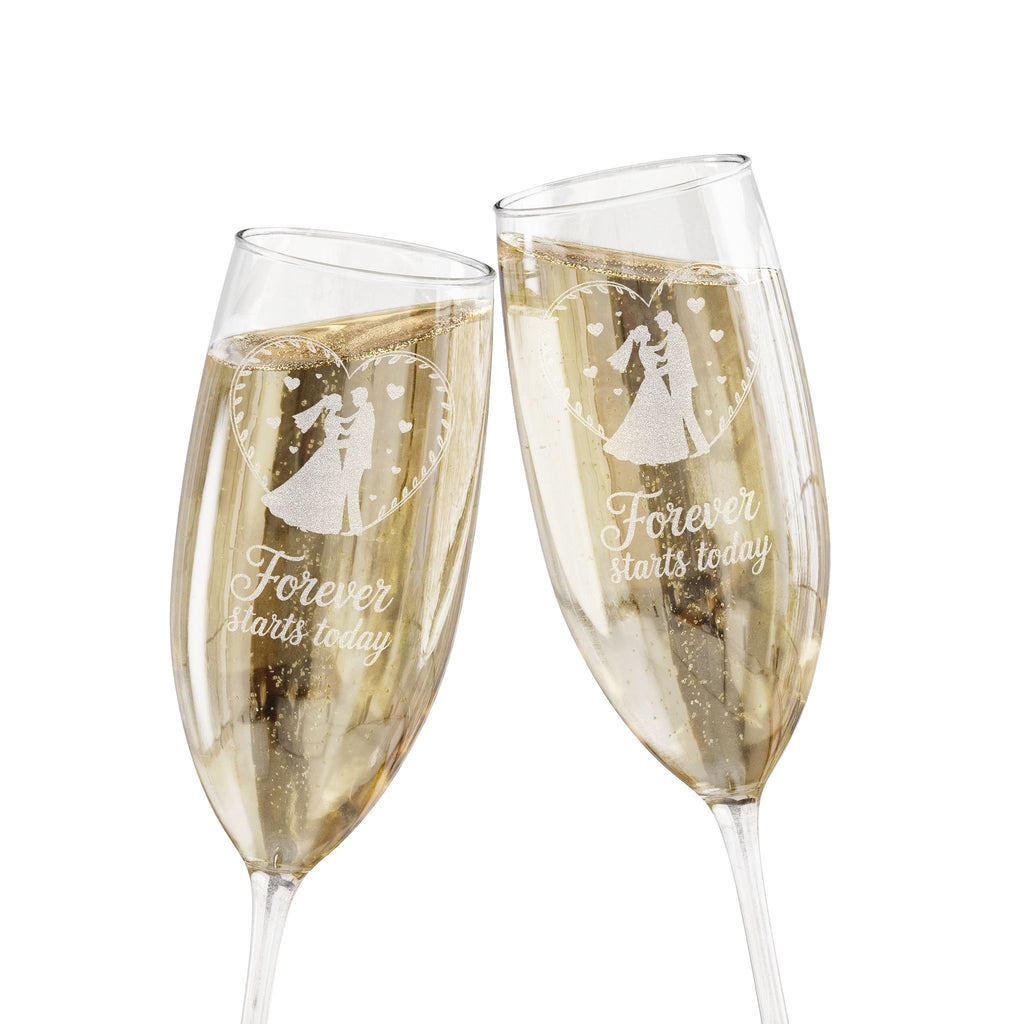 Two champagne flutes etched with a couple and "Forever starts today."