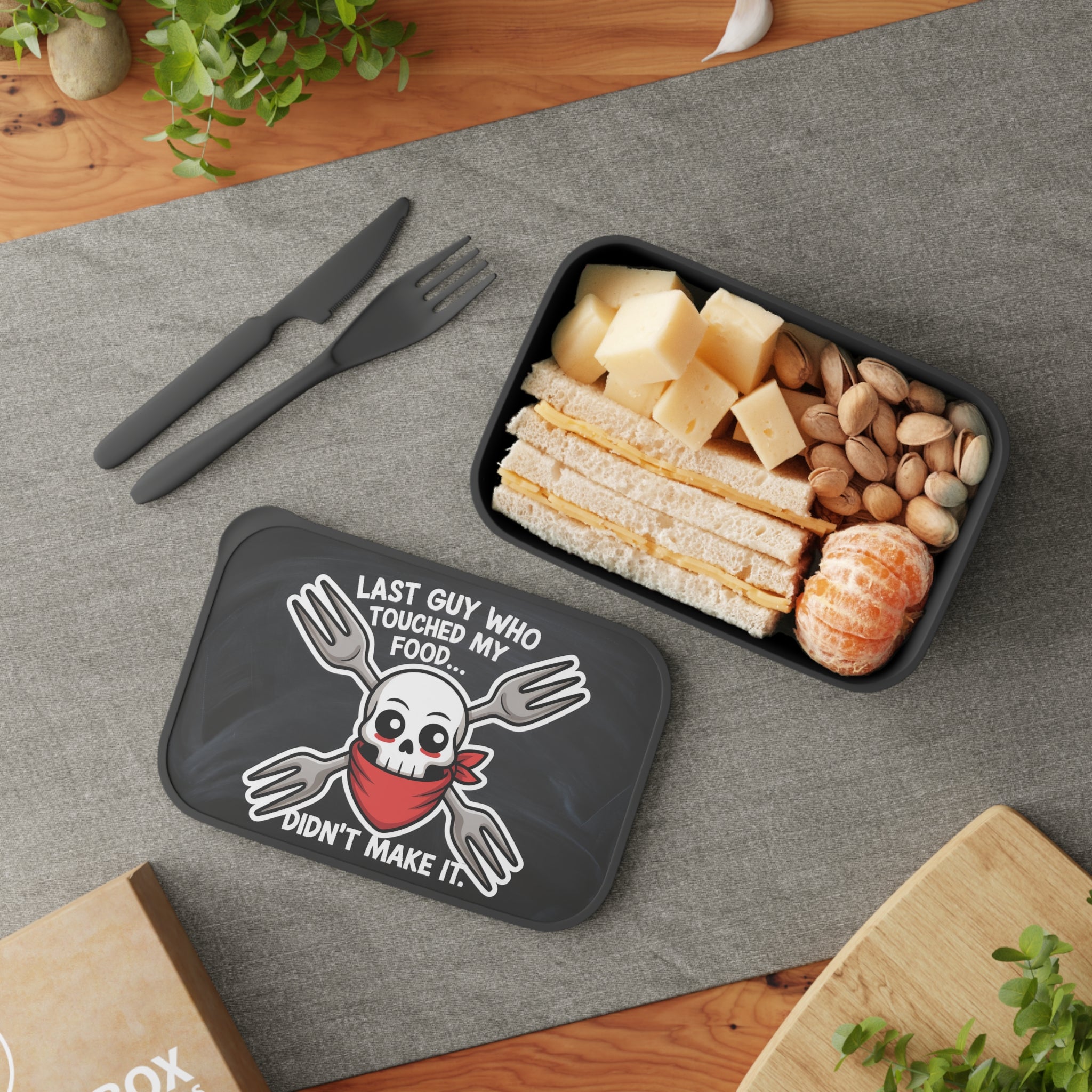 Lunchbox with skull graphic, "Last Guy Who Touched My Food Didn't Make It."