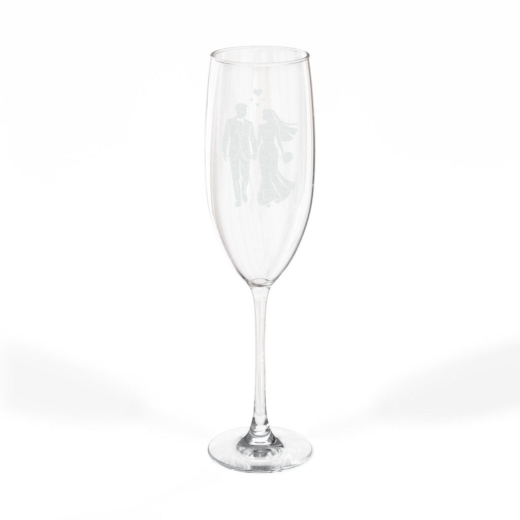 Champagne flute with etched silhouette of a bride and groom.