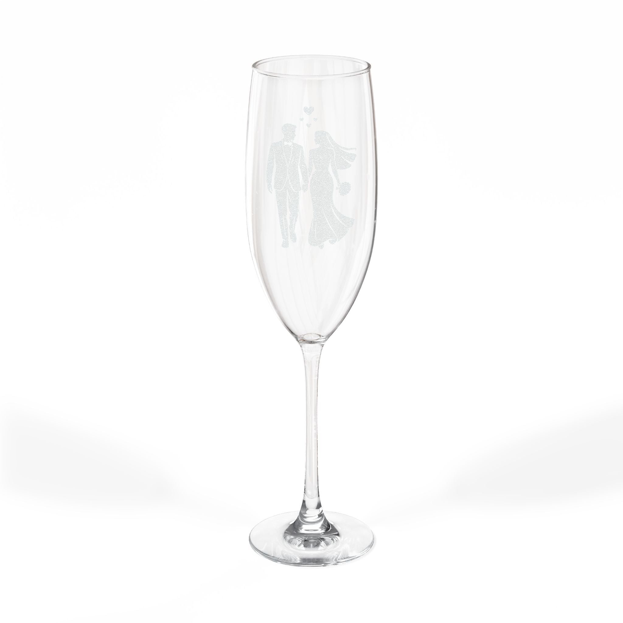 Champagne flute with etched silhouette of a bride and groom.