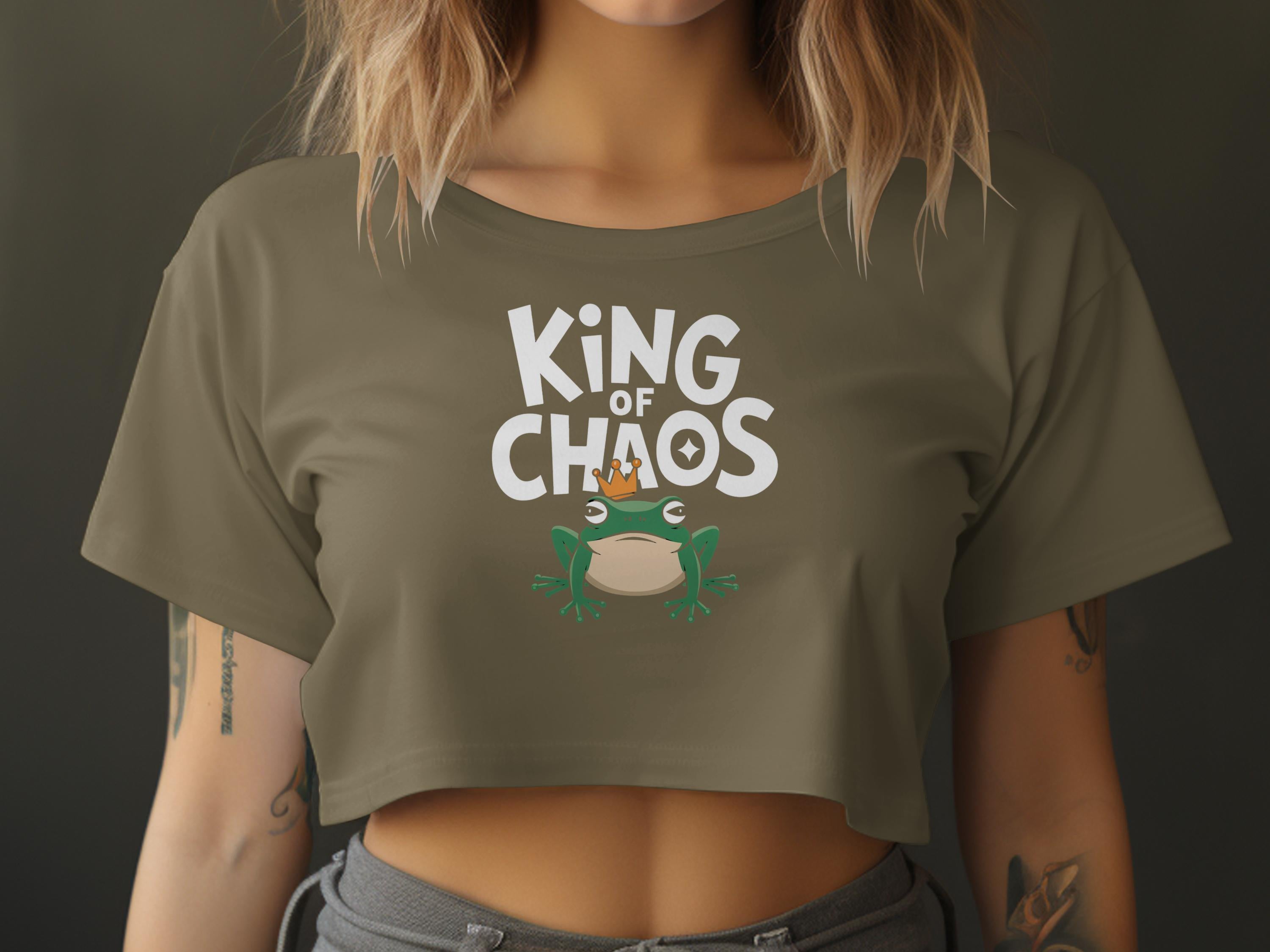 Cropped olive t-shirt with "King of Chaos" text and a crowned frog graphic.