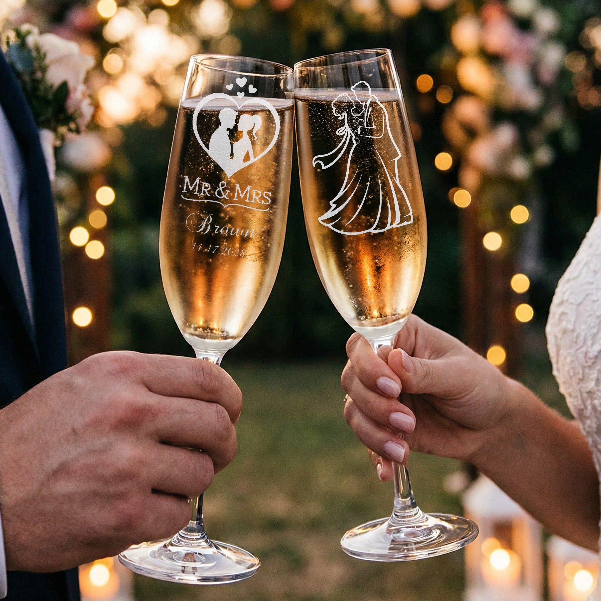 Engraved champagne flutes with couple silhouette and wedding date.