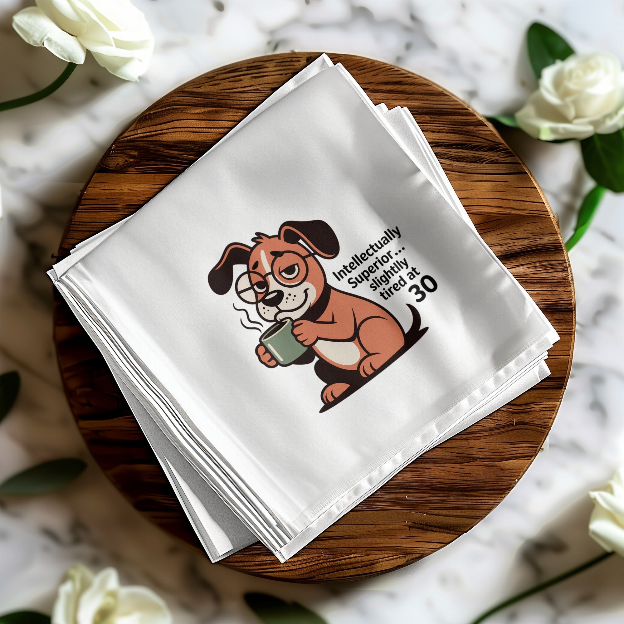 White napkin with cartoon dog wearing glasses holding mug, text "Slightly tired at 30".
