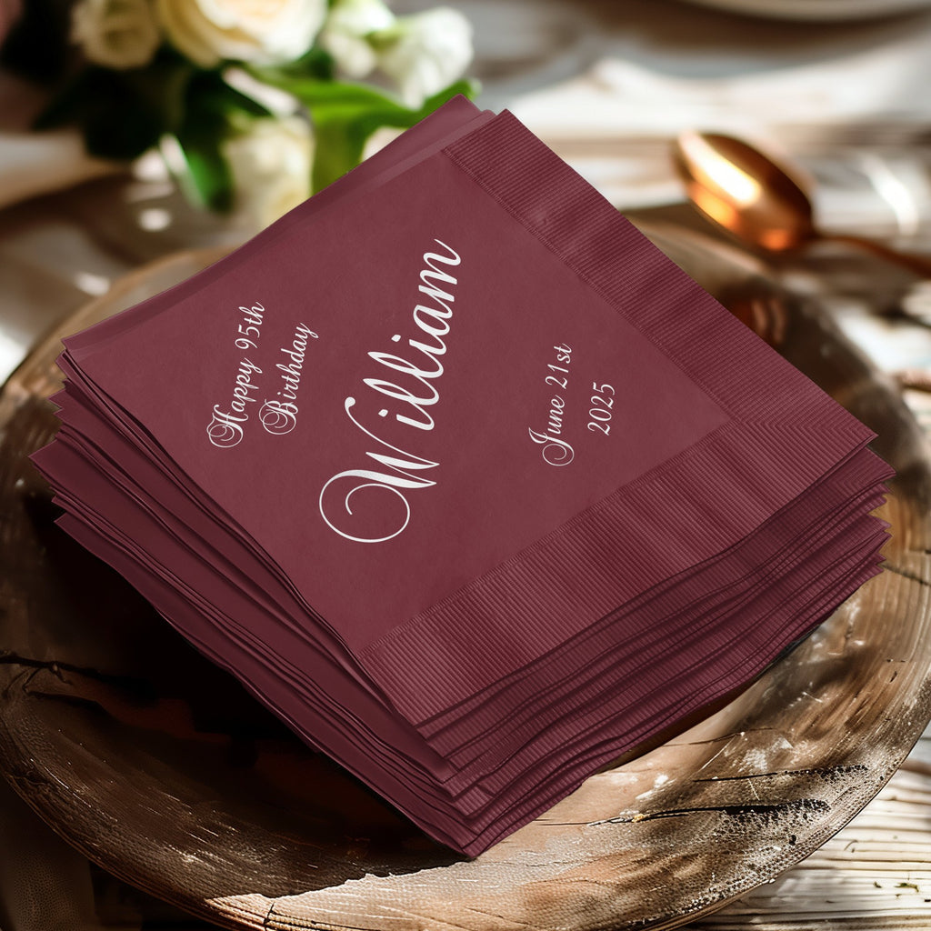 Burgundy napkins with "William Happy 95th Birthday June 21st 2025" in white script.