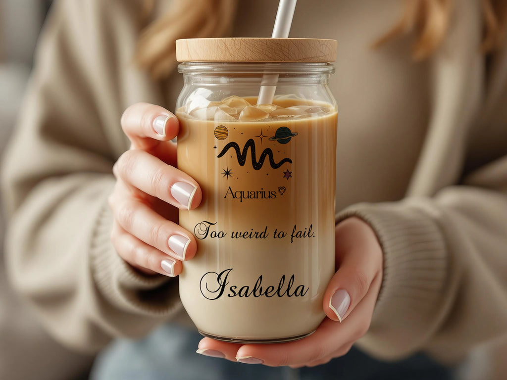 Glass tumbler with "Aquarius" design and "Isabella" name.