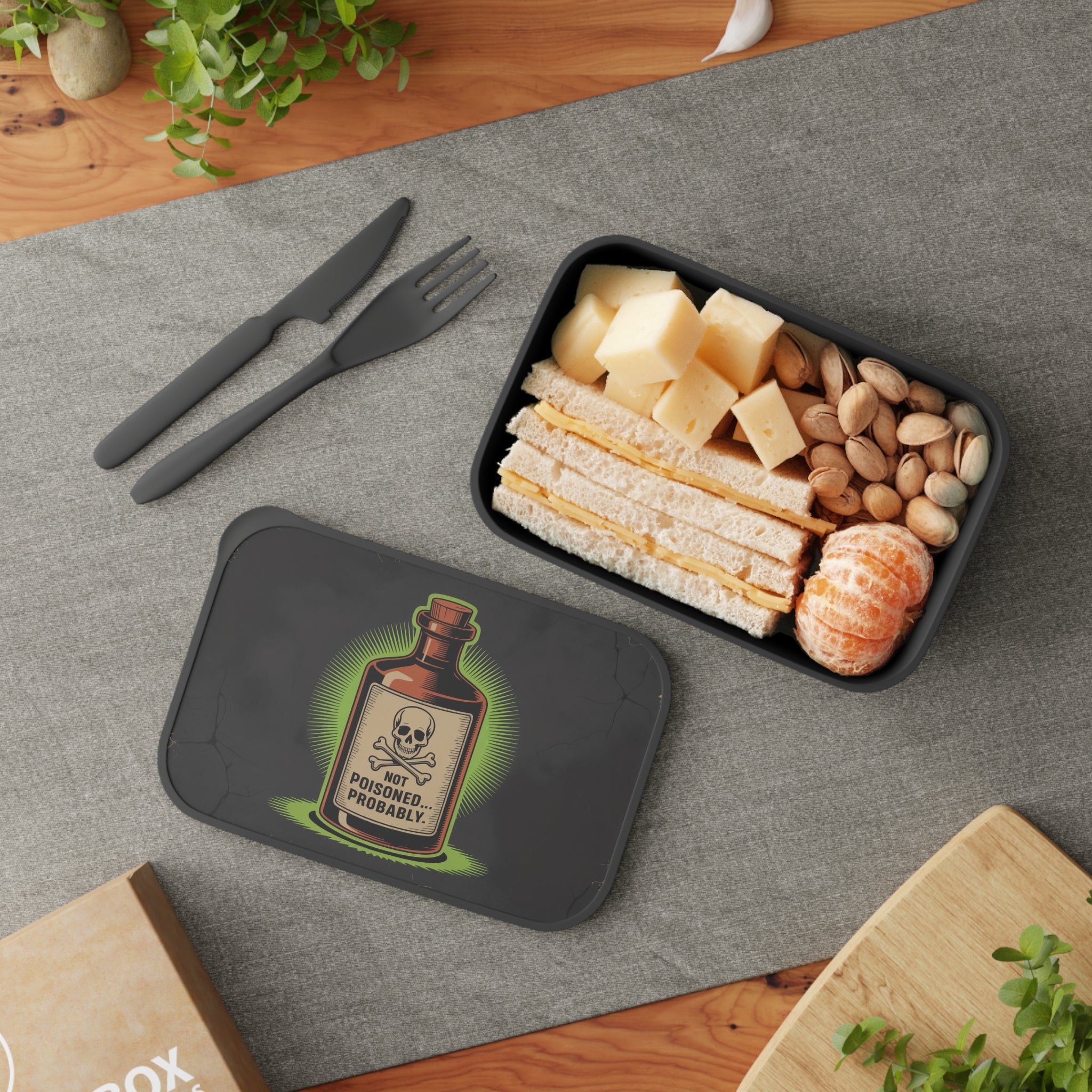 Lunchbox with a skull and crossbones warning and "NOT POISONED... PROBABLY." text.