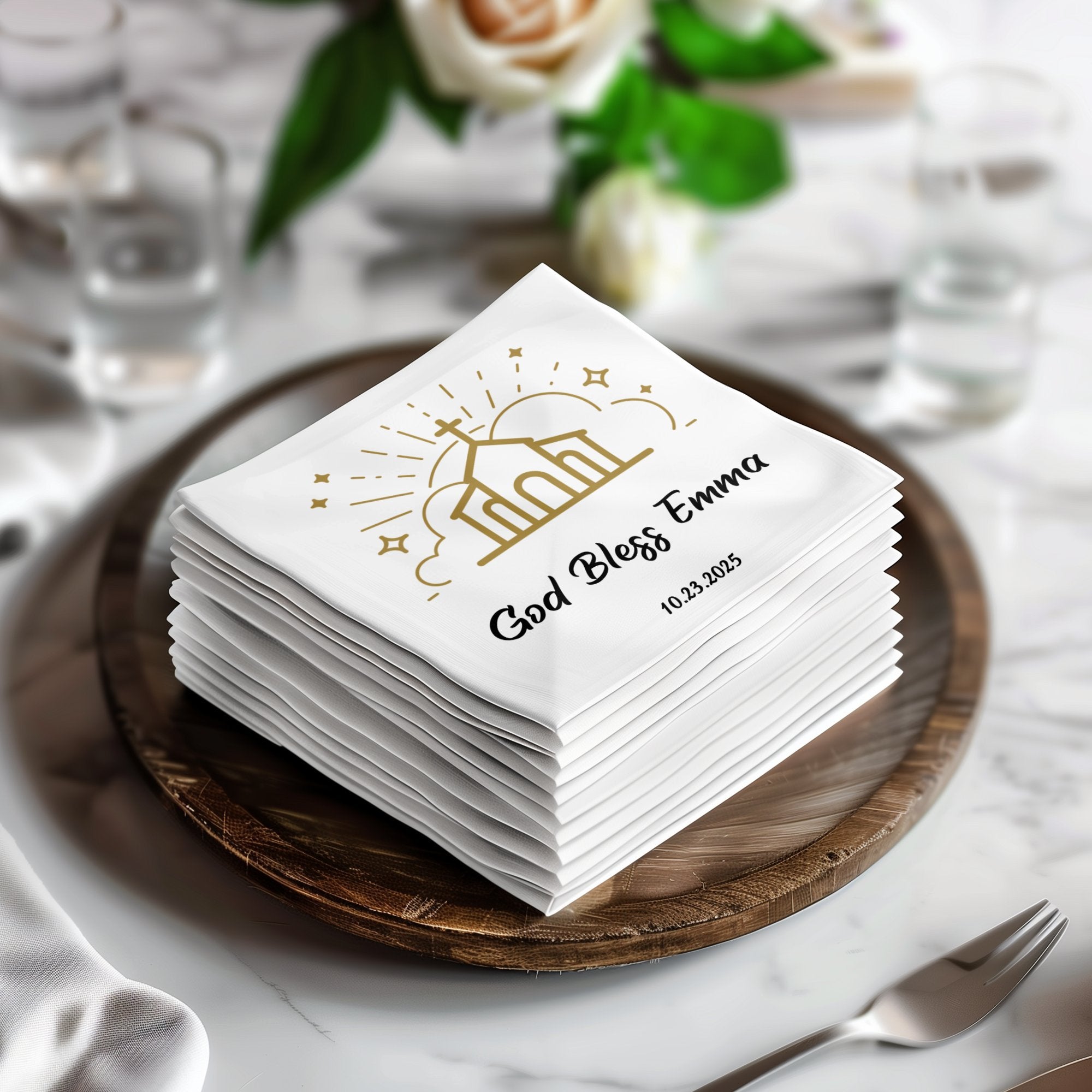 Stack of white napkins with "God Bless Emma 10.23.2025" and church graphic.