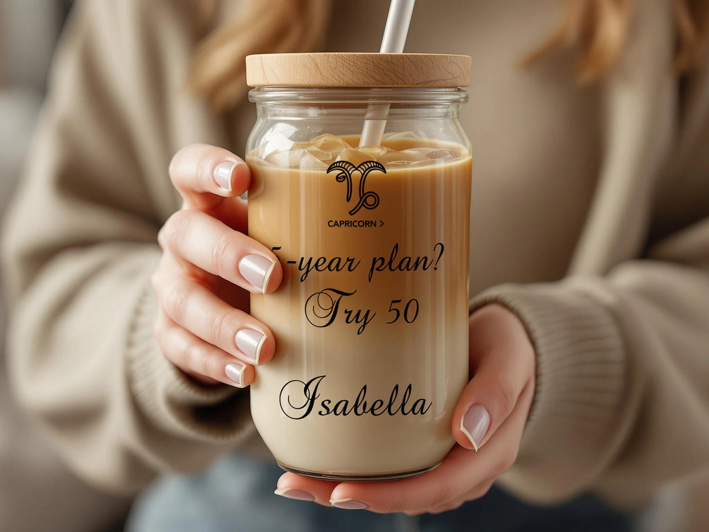 Capricorn zodiac symbol and text "5-year plan? Try 50 Isabella" on a glass jar.