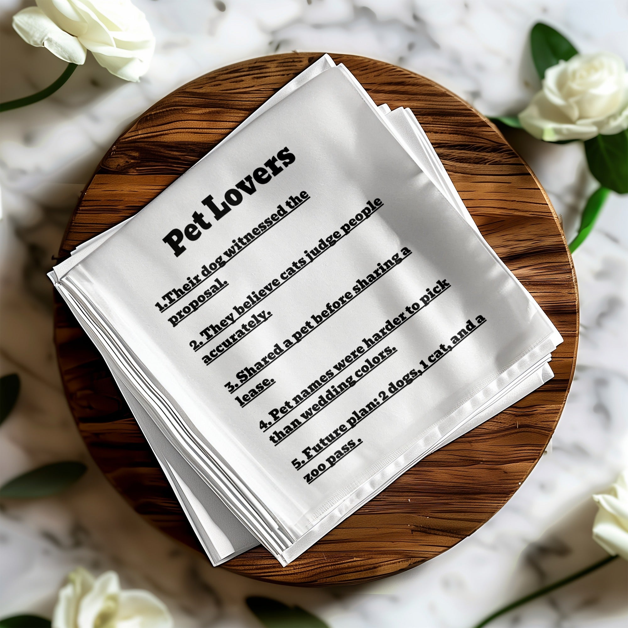 White linen napkin with "Pet Lovers" and a list of humorous rules.
