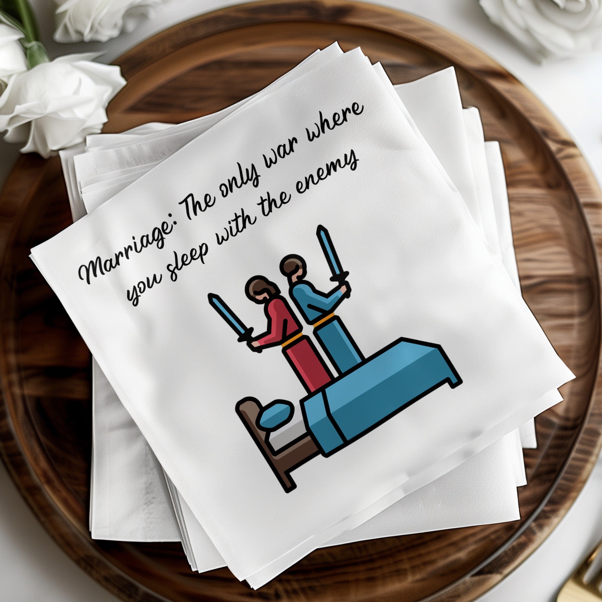 Napkins with cartoon couple in bed with swords, text reads "Marriage: The only war where you sleep with the enemy".