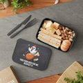 Lunchbox with chicken graphic and text, containing a sandwich, cheese, and nuts.