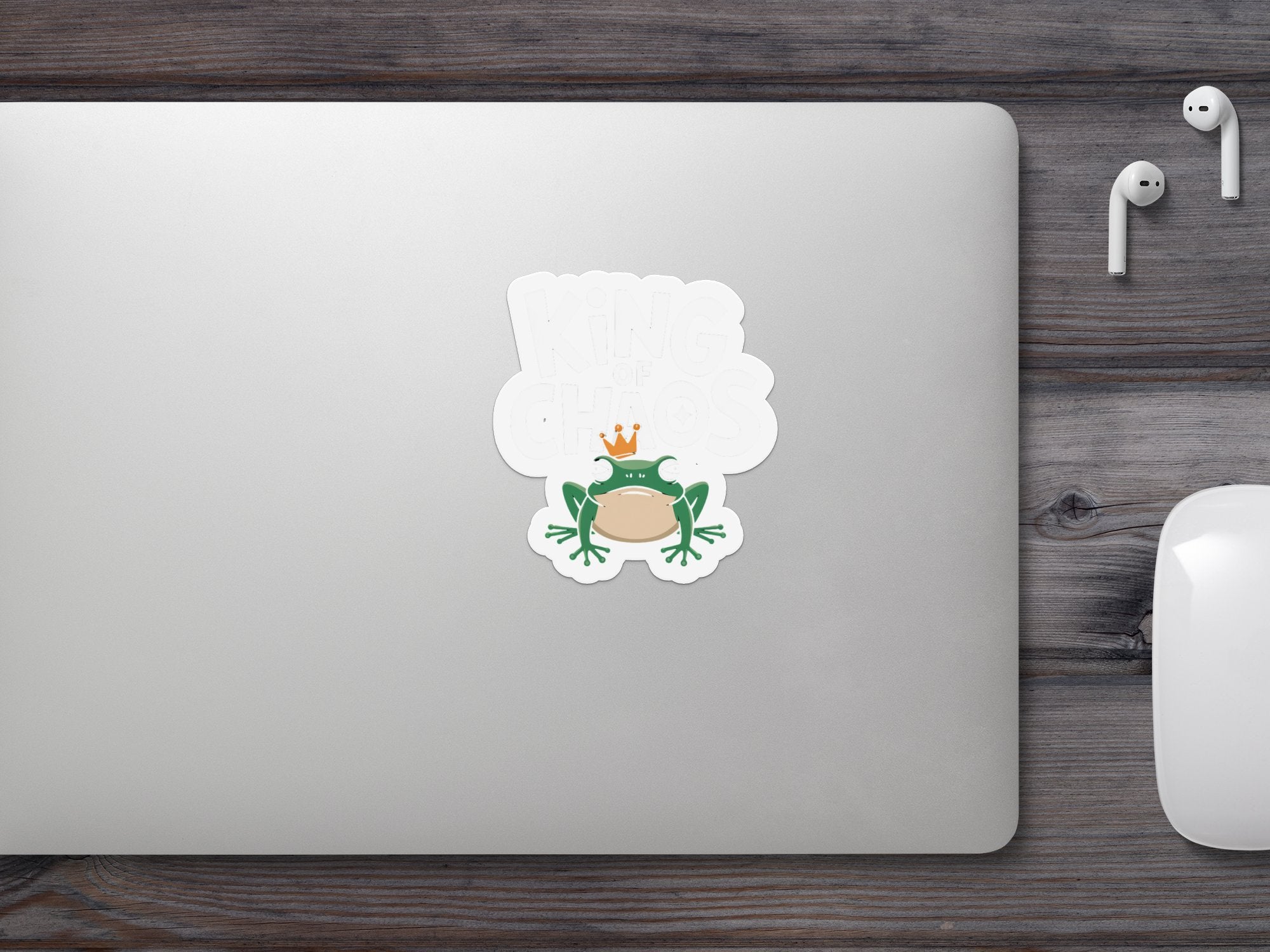 Frog sticker on a laptop reading "King of the Chaos".
