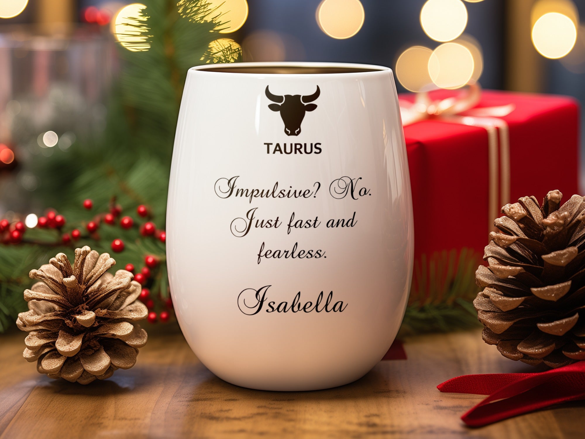 White mug with "TAURUS" and personalized text for Isabella, framed by festive decorations.