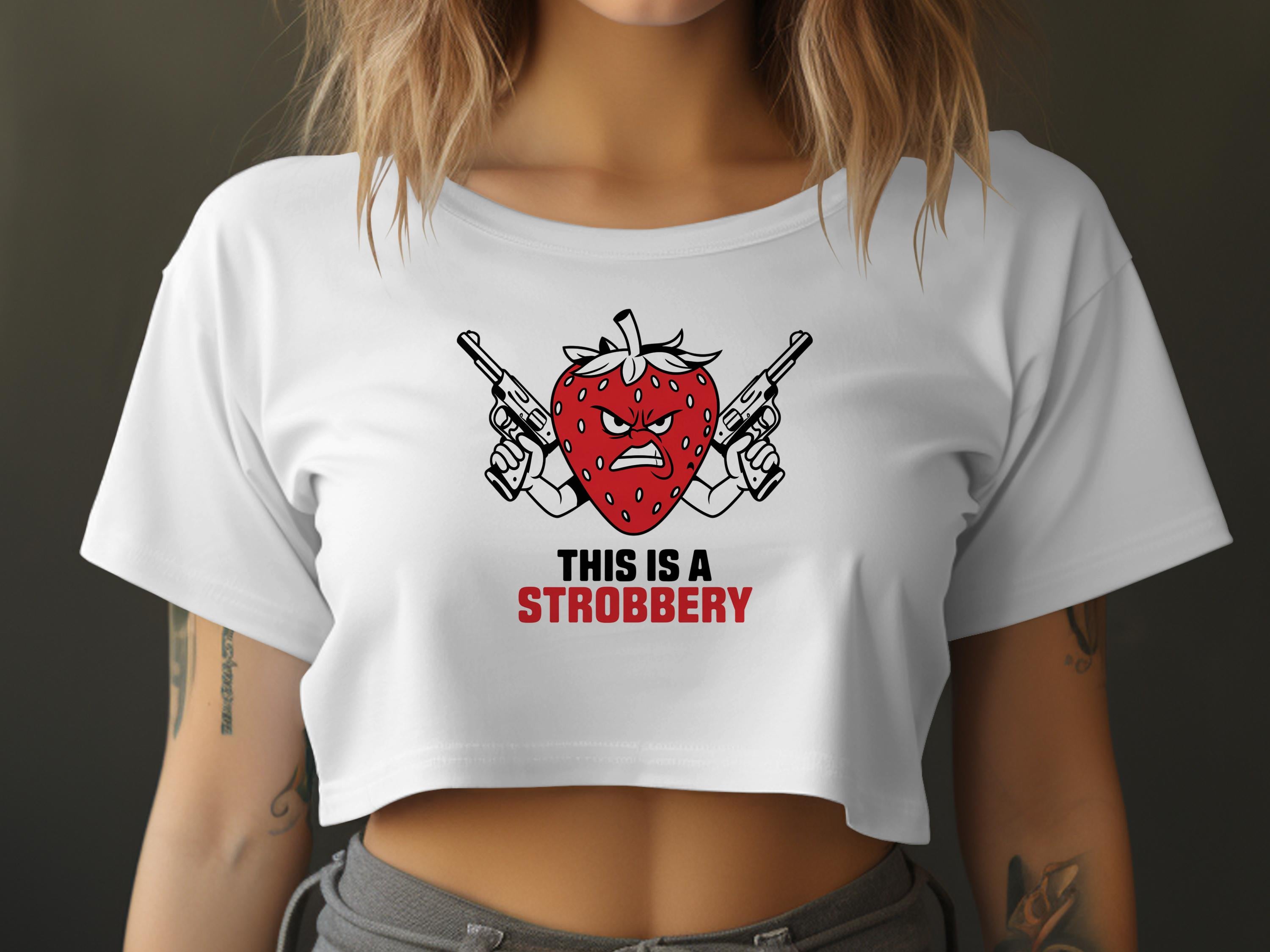 White cropped t-shirt with angry strawberry graphic and text "THIS IS A STROBERRY".