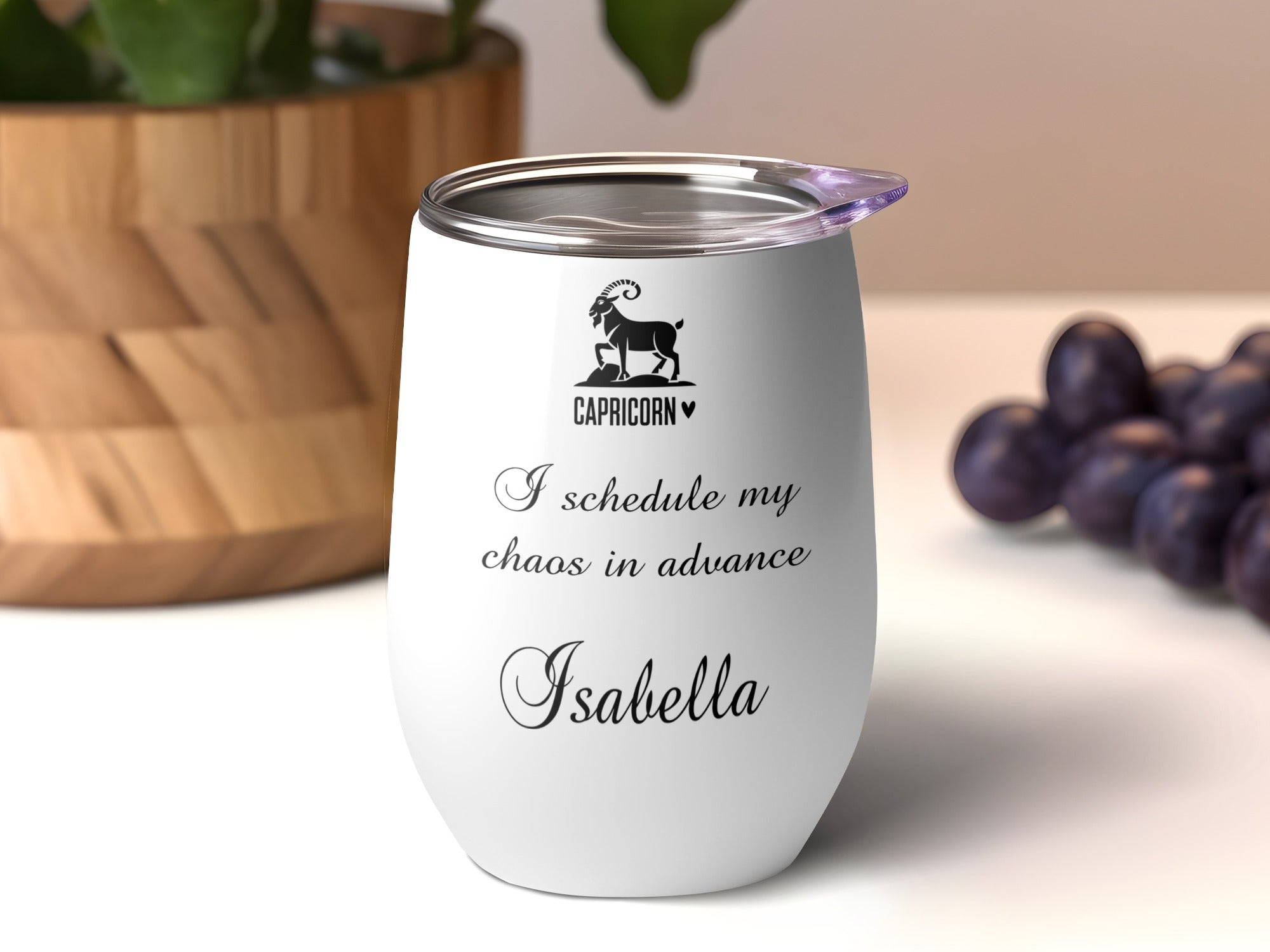 White wine tumbler with Capricorn zodiac symbol and custom text "Isabella".