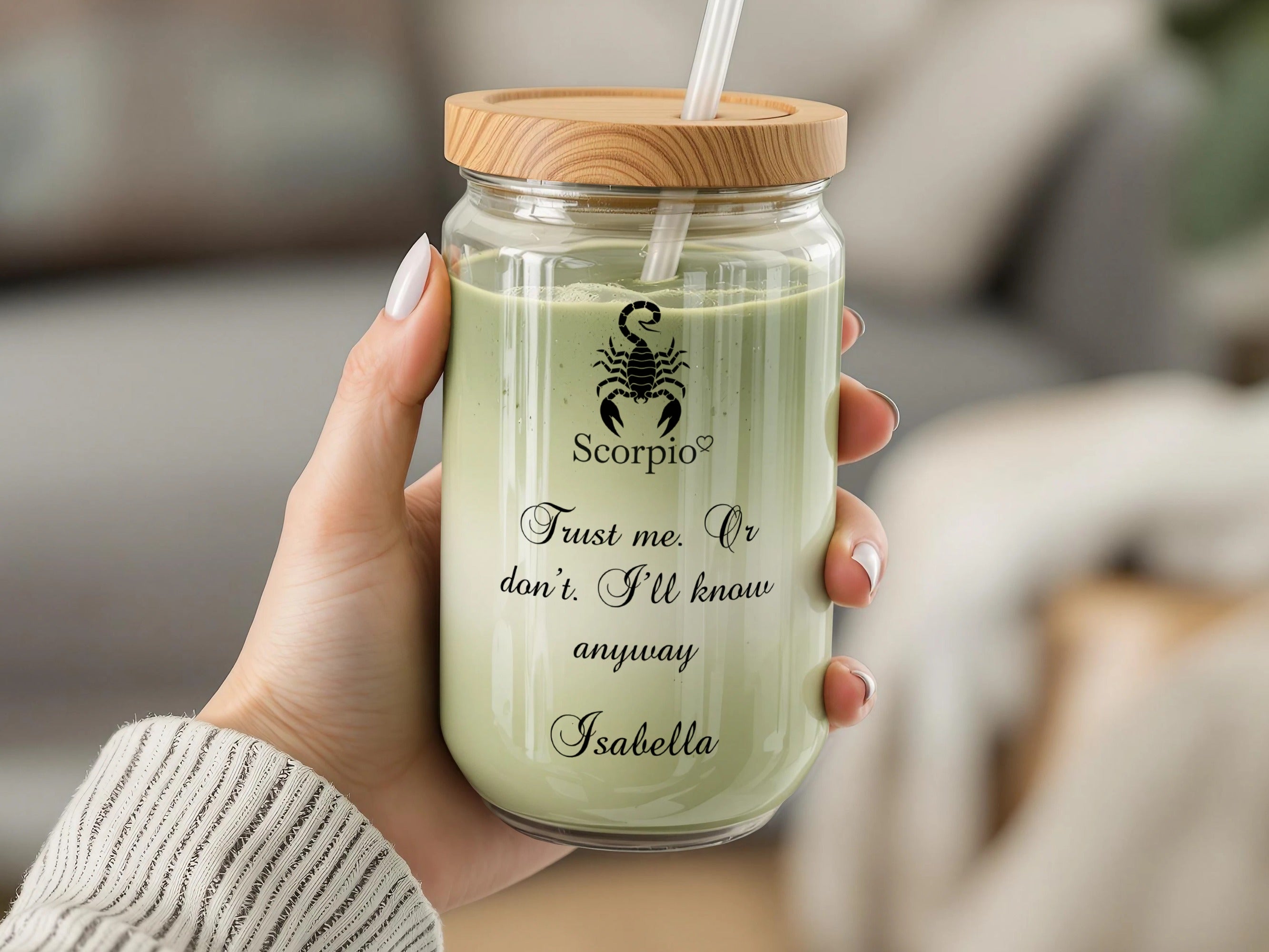 Glass tumbler with wooden lid and straw, featuring a scorpion and text.