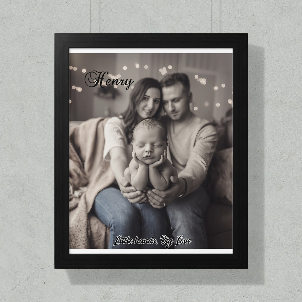 Black framed portrait of parents holding their baby, with text "Henry" and "Little hands, Big Love".