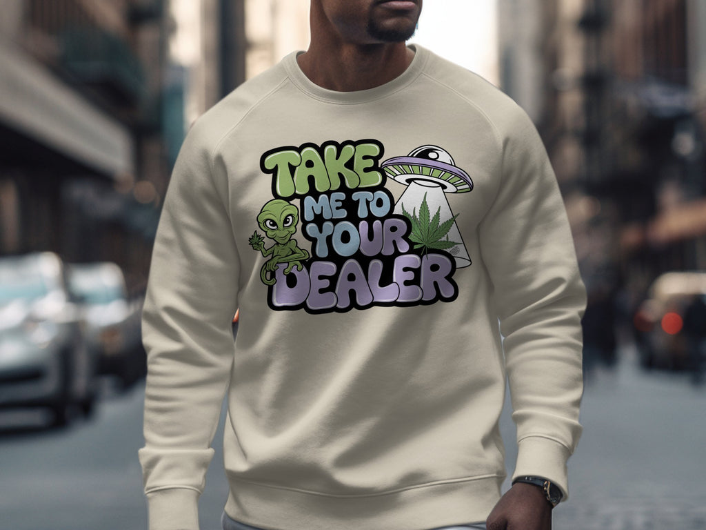 Cream sweatshirt with "TAKE ME TO YOUR DEALER" and alien/UFO graphic.