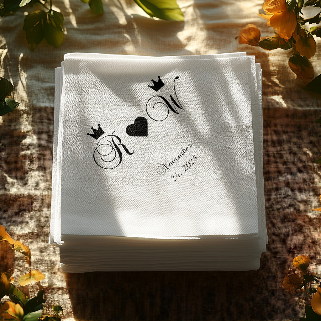 Stack of white paper napkins with R and W monogram, crown, and heart design.